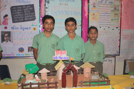 Students exhibiting their work in the Hindi Exhibition